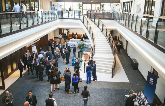 students walking through the atrium at the School of Law