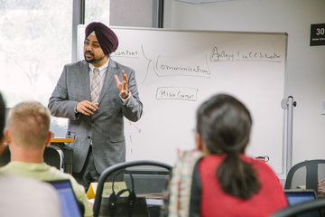 Straus Faculty Professor Singh lecturing in a class