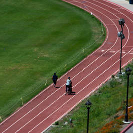 two people seen running along the track at Pepperdine
