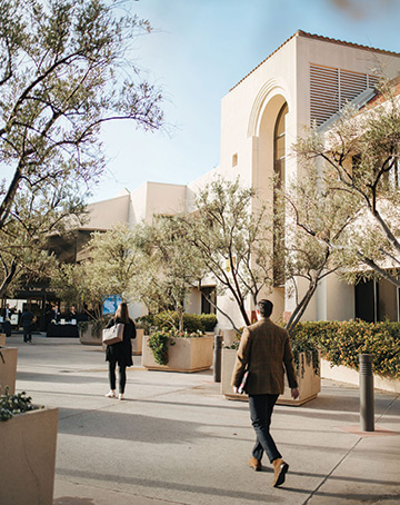 JD students walking in front of the law school building