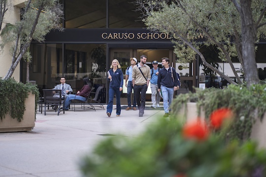 pepperdine students walking outside caruso school of law building