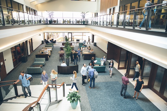 students walking and talking at the pepperdine caruso school of law building