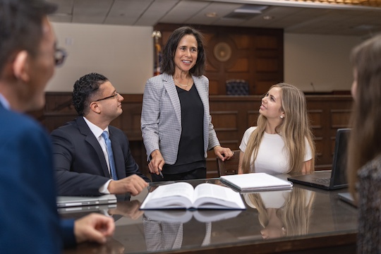 pepperdine law students around an office table