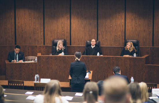 three judges sit on a bench in the Appellate Courtroom