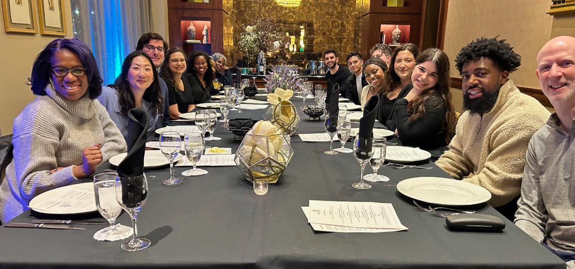 2025 Faith and Justice Trip at a dinner