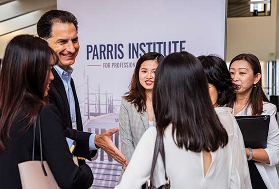 Parris Institute speaker shaking hands with law students at Launch Week