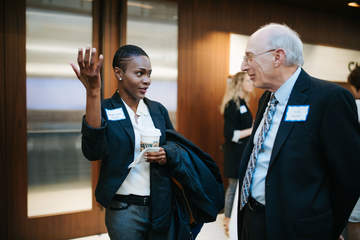 A Caruso Law student speaks with her mentor