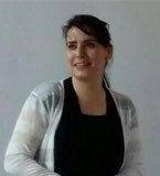 Hala Shaat photo wearing black shirt and white sweater