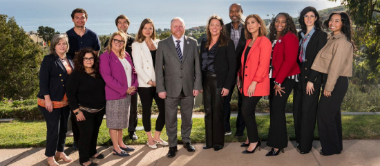 Group of Straus staff standing together outside in Malibu