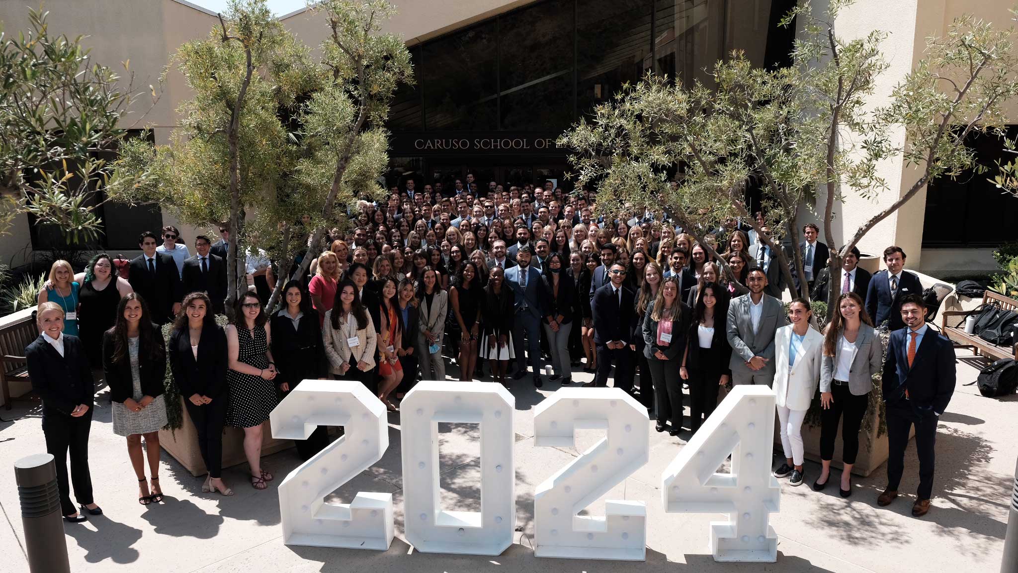 The Class of 2024 group photo in front of the Caruso School of Law