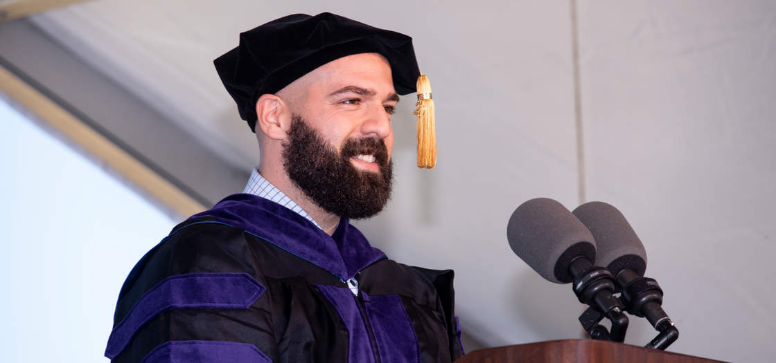 Luke Manzo delivering a commencement address