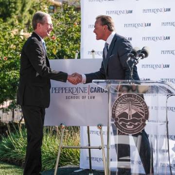 Rick Caruso and Paul Caron shaking hands