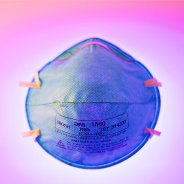 image of a blue mask with pink background