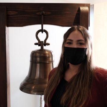 Gabriella Castro with jobs bell