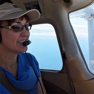 Jennifer Perdigao flying a plane over Catalina Island