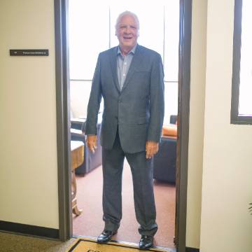 Jim McGoldrick standing in office doorway