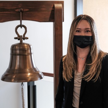 Lauren Elvick with jobs bell