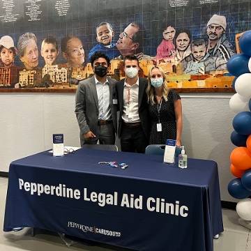 Students at Pepperdine Legal Aid Clinic table