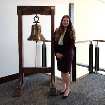 Mackenna Johnson with jobs bell