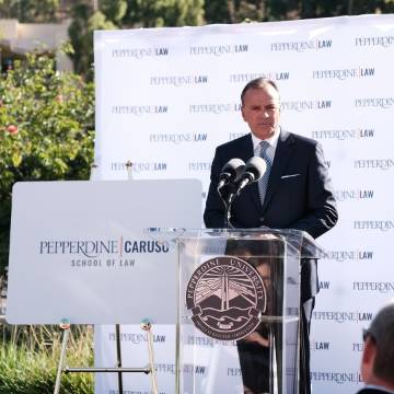 Rick Caruso standing at outdoor CSOL podium