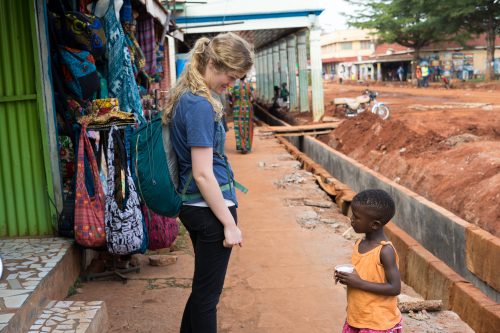 Student Sarah Parker talks to a child in Uganda