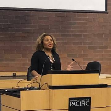 Tiffany Williams speaking at podium