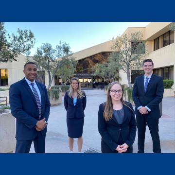 Trial team members in front of Caruso Law entrance